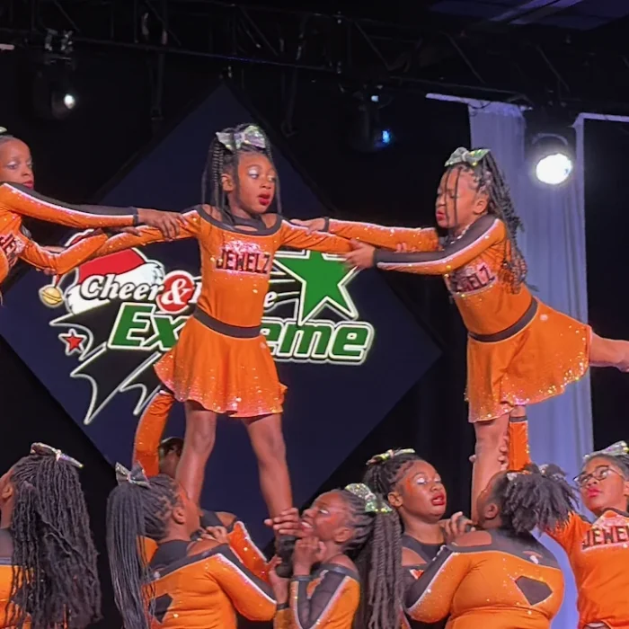 CBL cheer squad performing a stunt at a competition