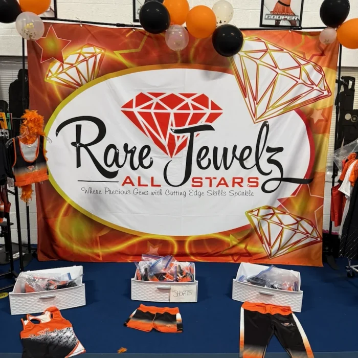 Rare Jewelz All Stars banner with team trophies and uniforms