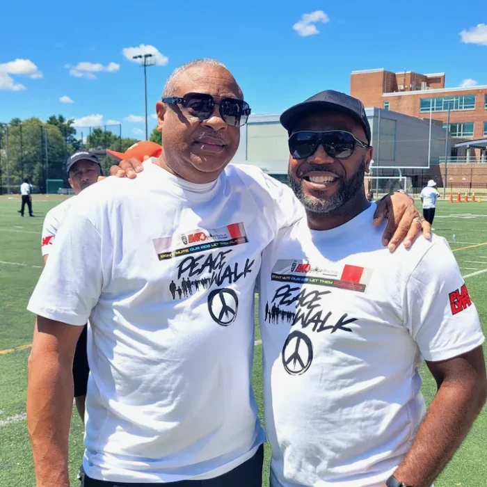 Two CBL coaches on the sideline on a game day